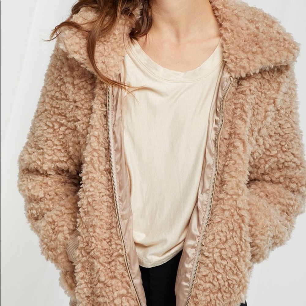 Never been worn, curly collared jacket.